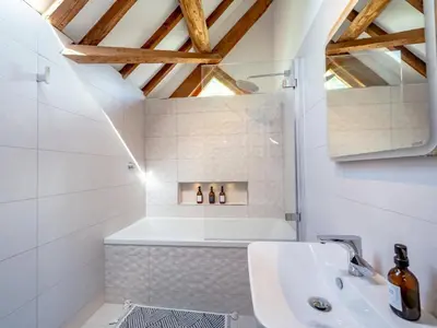 a bathroom with a sink and a bath tub at Countryside home 5 minutes from Ludlow - Pass the Keys in Ludlow