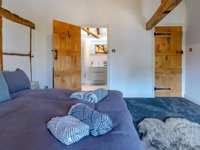 a bedroom with a bed with two pillows on it at Countryside home 5 minutes from Ludlow - Pass the Keys in Ludlow