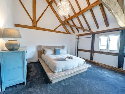 a bedroom with a bed and a light blue cabinet at Countryside home 5 minutes from Ludlow - Pass the Keys in Ludlow