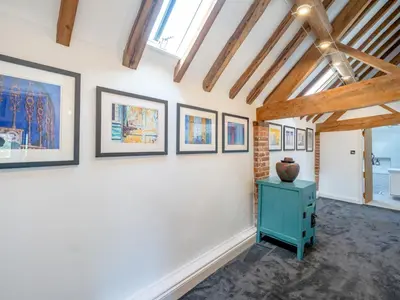 a room with paintings on the wall and a blue cabinet at Countryside home 5 minutes from Ludlow - Pass the Keys in Ludlow