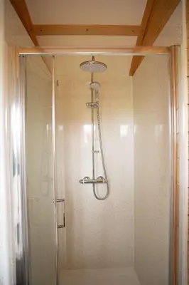a shower with a glass door in a bathroom at Aberystwyth by Wigwam Holidays in Aberystwyth