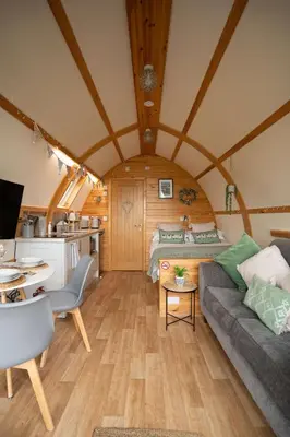 a living room with a couch and a table in a room at Aberystwyth by Wigwam Holidays in Aberystwyth