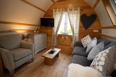 a living room with a couch and a chair at Aberystwyth by Wigwam Holidays in Aberystwyth