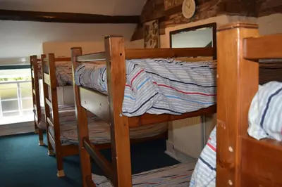 a couple of bunk beds in a room at River Wye Hostel in Hereford