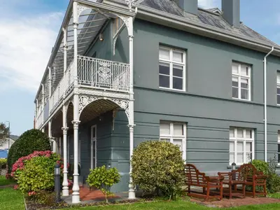 a blue house with a balcony on it at Uk47787 - Flat 5E in Aberystwyth