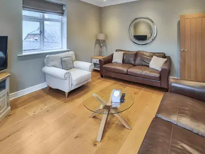 a living room with a couch and a chair at Uk47787 - Flat 5E in Aberystwyth
