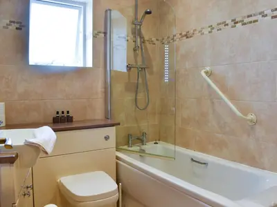 a bathroom with a shower and a toilet and a sink at Flat 3E - Uk47858 in Aberystwyth