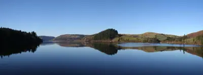a large body of water with mountains in the background at 1 Bed in Brithdir oc-w30045 in Rhydymain