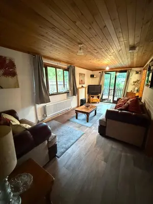 a living room with a couch and a table at Glamping Life Retreat in Nantmel