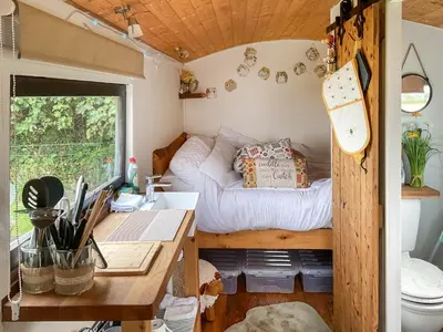 a small room with a bed and a desk at Myfanwy in Ciliau-Aeron