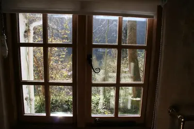 a window with a view of a forest at Mellow Mountain Eco Retreat Wales Hot-Tub Sauna in Glyn-Ceiriog