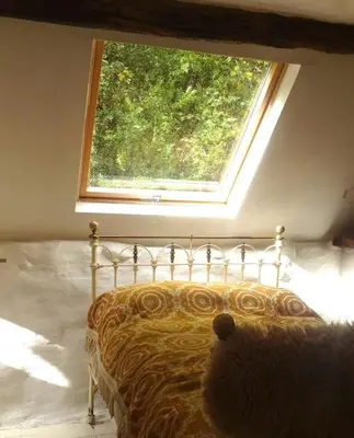 a bedroom with a bed with a large window at Mellow Mountain Eco Retreat Wales Hot-Tub Sauna in Glyn-Ceiriog