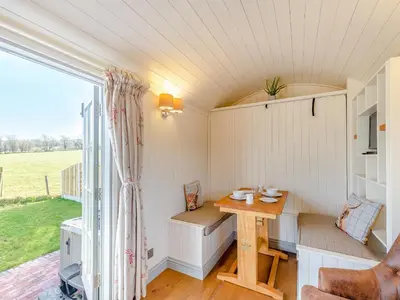 a small room with a table and a window at Sunflower - Uk42360 in Saint Harmon