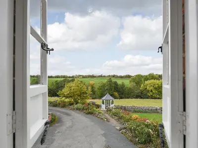 an open window with a view of a road at The Old Coach House -Uk41272 in Great Hanwood