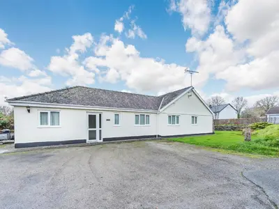 a large white house with a driveway at Snowdrop in Llanerch-Aeron