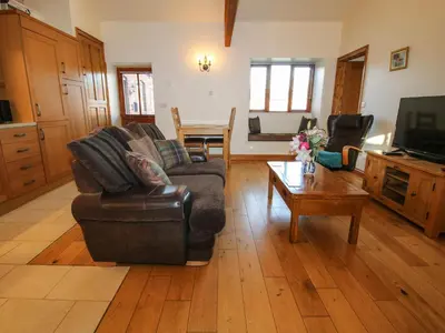 a living room with a couch and a coffee table at The Cart House in Shrewsbury