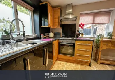 a kitchen with a sink and a stove top oven at 2 Bedroom Home near Theatre Severn with Parking in Shrewsbury