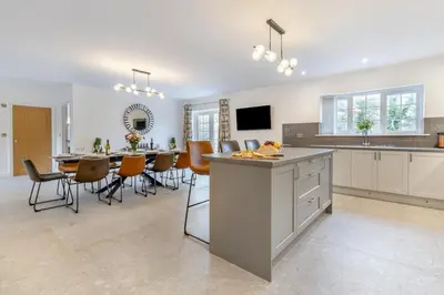 a kitchen and dining room with a table and chairs at 4 Bed in Capel Bangor oc-m30145 in Capel Bangor
