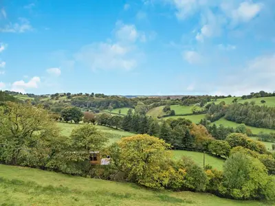 a view of a green field with trees at 1 Bed in Llanerfyl oc-d30168 in Llanfair Caereinion