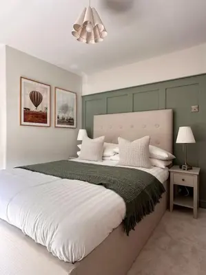 a bedroom with a large bed with white pillows at Charming Townhouse Retreat in Shrewsbury