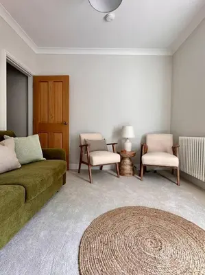 a living room with a couch and two chairs at Charming Townhouse Retreat in Shrewsbury