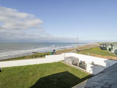 a view of the beach from the roof of a house at The Gables in Tywyn