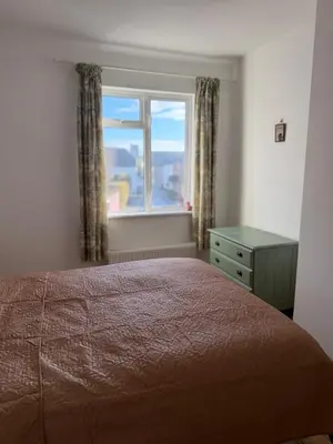 a bedroom with a bed and a window at 3 bedroom cottage Brecon sleeps 4 in Brecon