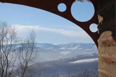 a view of a snow covered mountain from a window at Hilltop Train Carriage with a View in Machynlleth