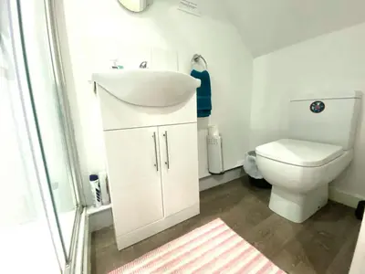 a bathroom with a sink and a toilet at Cosy Corner - Town centre flat with free nearby parking in Shrewsbury