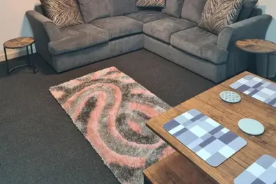a living room with a couch and a table at Cosy Nook - Town centre flat with free nearby parking, in Shrewsbury