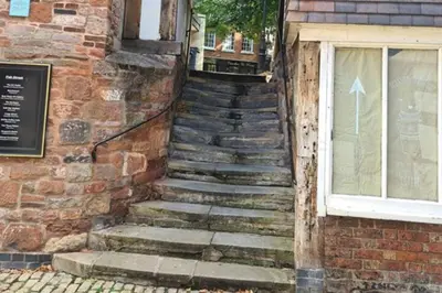 a set of stairs outside of a building with a window at Cosy Nook - Town centre flat with free nearby parking, in Shrewsbury