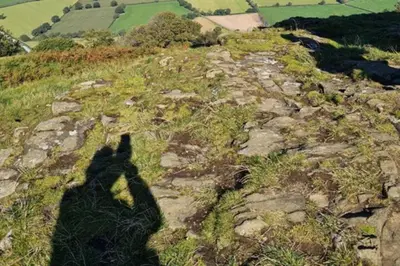 two shadows of people on top of a mountain at Cosy Nook - Town centre flat with free nearby parking, in Shrewsbury