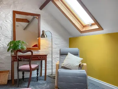 a room with a desk and a chair and a mirror at The Hideaway in Tregaron