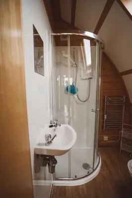 a bathroom with a shower and a sink at Hafren by Wigwam Holidays in Llanbrynmair