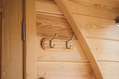 a wooden door with a metal handle on it at Hafren by Wigwam Holidays in Llanbrynmair