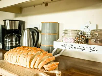 a loaf of bread on a cutting board on a counter at 2 Bed in Llandrindod Wells oc-88203 in Llandegley