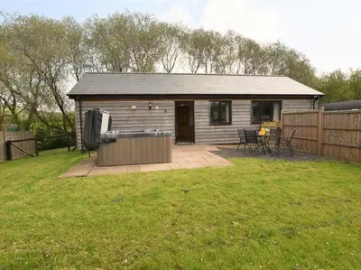 a small house in a yard next to a fence at 2 Bed in Llandrindod Wells oc-88203 in Llandegley
