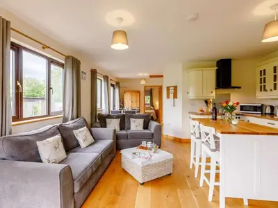 a living room with a couch and a kitchen at 2 Bed in Llandrindod Wells oc-88203 in Llandegley
