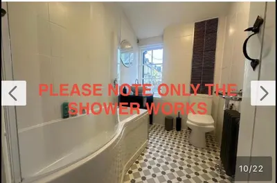 a bathroom with a bath tub and a toilet at Charming newly renovated 3 bed cottage in Brecon town with private garden & pets welcome in Brecon