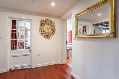 a room with a mirror on the wall and a door at 7 Bed in Talgarth oc-h30349 in Talgarth