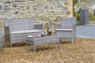 two chairs and a table in front of a building at 2 Bed in Capel Bangor oc-m30146 in Capel Bangor