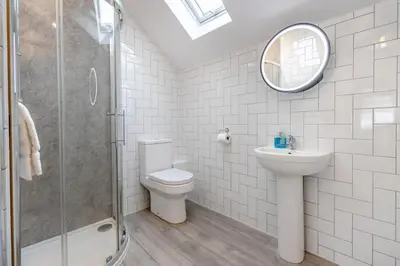 a bathroom with a sink toilet and a mirror at 2 Bed in Capel Bangor oc-m30146 in Capel Bangor