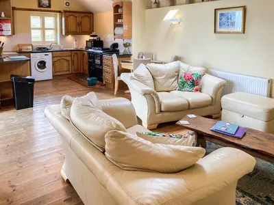 a living room with two couches and a table at Stevannah - E5287 in Snead