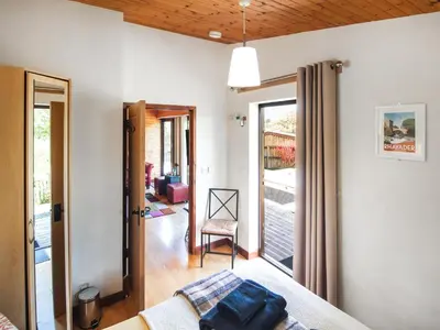a room with a bed and a sliding glass door at Ash Lodge - Hw7442 in Nantmel