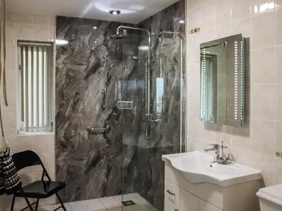a bathroom with a sink and a shower at Berwyn - Uk48507 in Bala