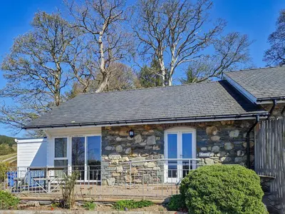 a stone cottage with a gray roof at Arenig - Uk48508 in Bala