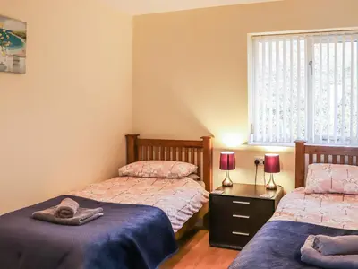 a bedroom with two beds and a window at Arenig - Uk48508 in Bala