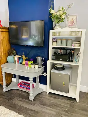 a white table with a tv in a room at Sy3 Shrewsbury in Shrewsbury