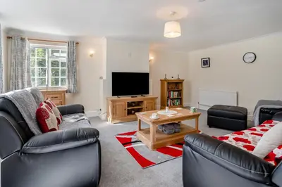 a living room with a couch and a tv at 3 Bed in Scethrog oc-h30013 in Scethrog