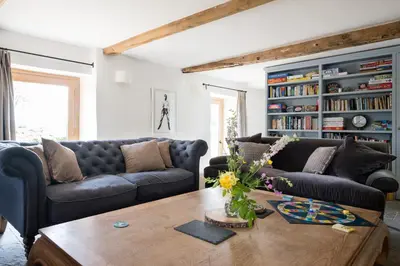 a living room with two couches and a coffee table at Welsh Border Escape- Perfect for families & groups in Clyro